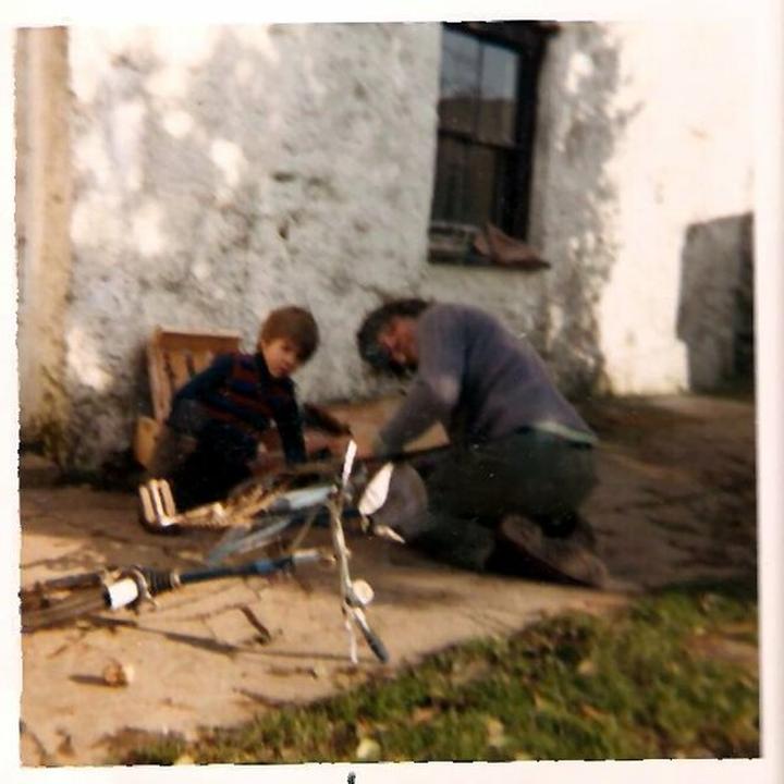 My Brother Dan and my Dad, John repairing Dans bike
