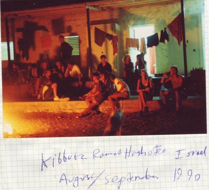 Ramat Hashofet in 1990. A blurry old night time photo of my friends and I around a fire outside some huts